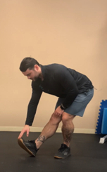 Man stretching out his legs to releive tight hamstrings